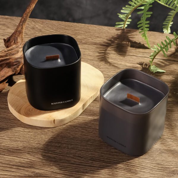 close-up of wooden wick inside grey jar candle
