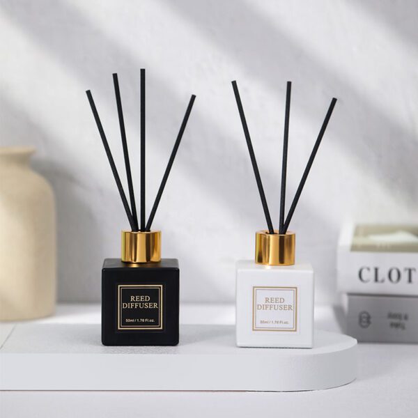 Minimalist diffuser bottles in monochrome with gold caps
