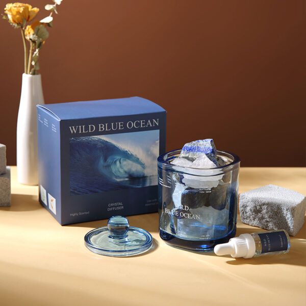 Blue glass crystal diffuser labeled “Wild Blue Ocean” and packaging