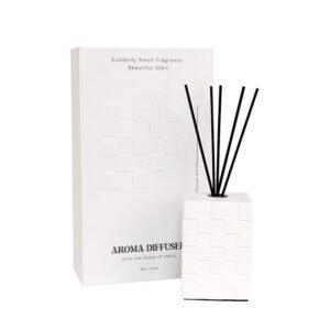 White grid diffuser bottle placed on wooden platform with minimal decor