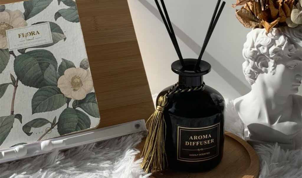 Are reed diffusers safe – black reed diffuser on tray in sunlight