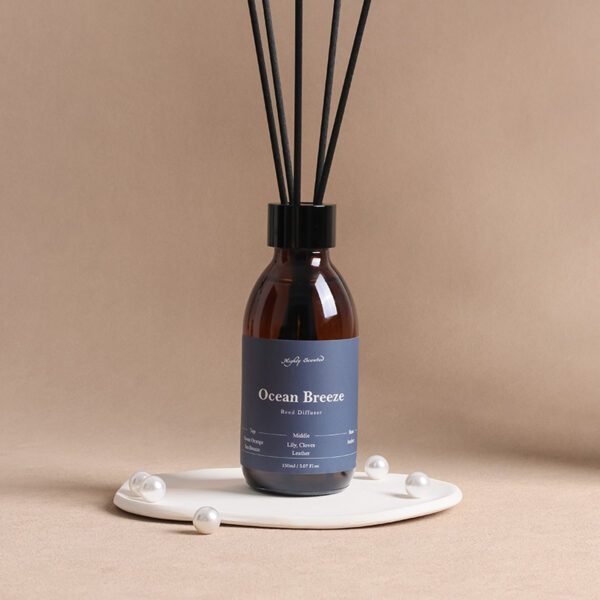lifestyle shot: Ocean Breeze amber diffuser on coffee table with coastal décor